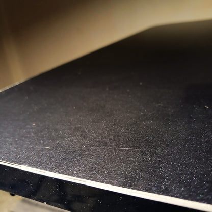 Electric standing desk with black high gloss finish